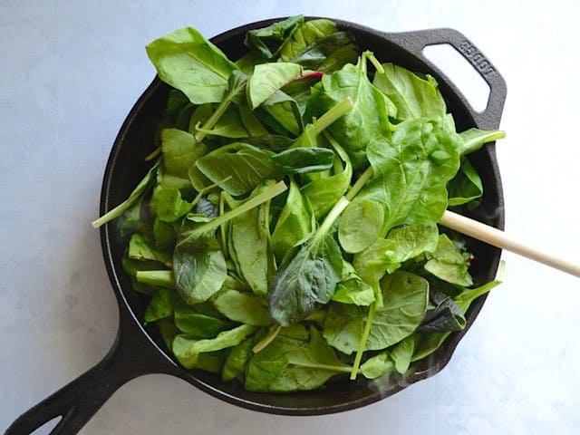 Fresh Spinach added to the skillet