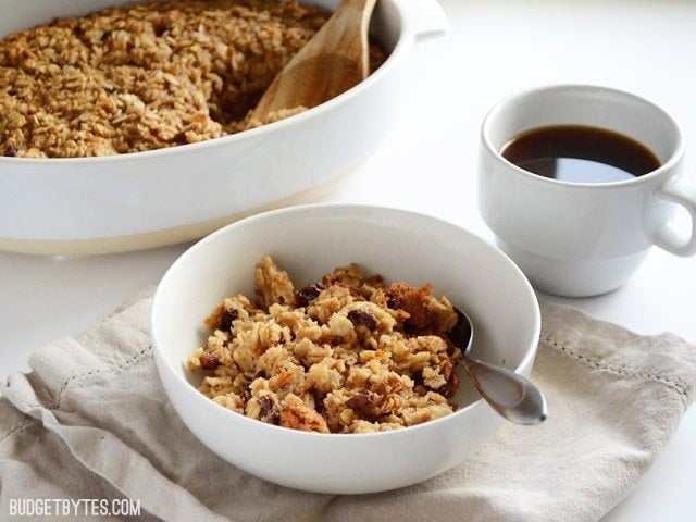 Front view of a bowl of "Oatmeal Cookie" Baked Oatmeal casserole dish in the back
