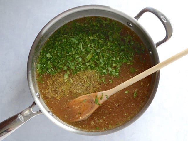 Lemon pepper and fresh parsley added to the broth