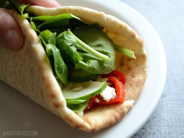 Close up of hummus wrap folded closed.