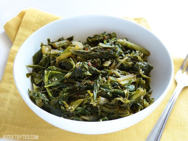 Side view of a bowl of Vegetarian Mustard Greens
