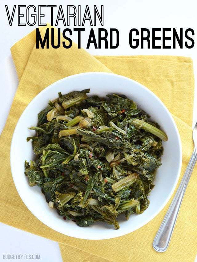 Overhead view of a bowl of Vegetarian Mustard Greens on a yellow napkin