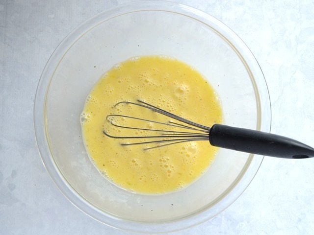 Whisked Eggs and Milk in a glass bowl