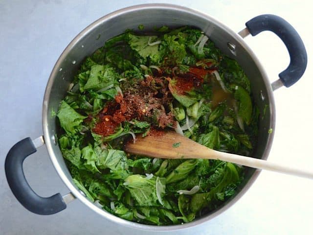 Wilted mustard Greens and Spices in the pot