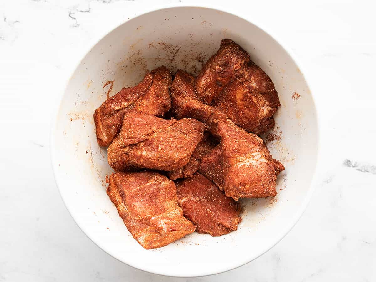 Seasoned pork butt pieces in a bowl