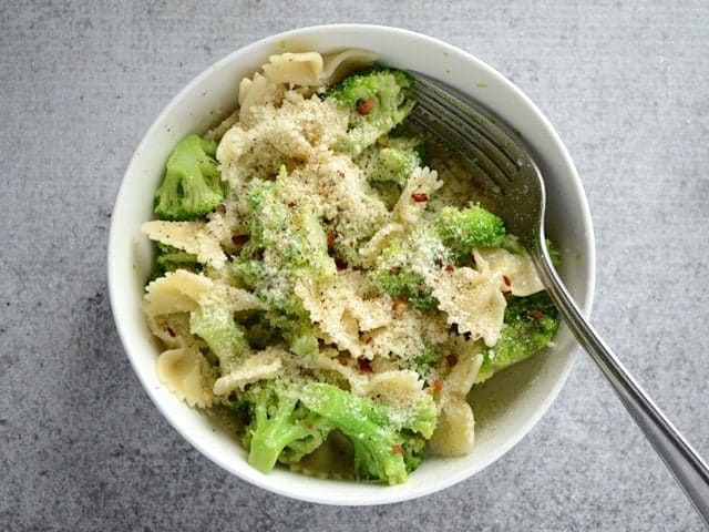 Parmesan, salt, pepper, and crushed red pepper added to the bowl