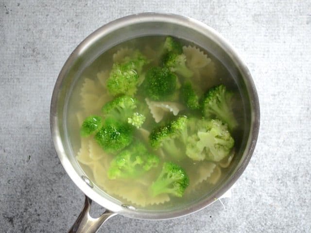 Pasta and broccoli in a sauce pot full of water