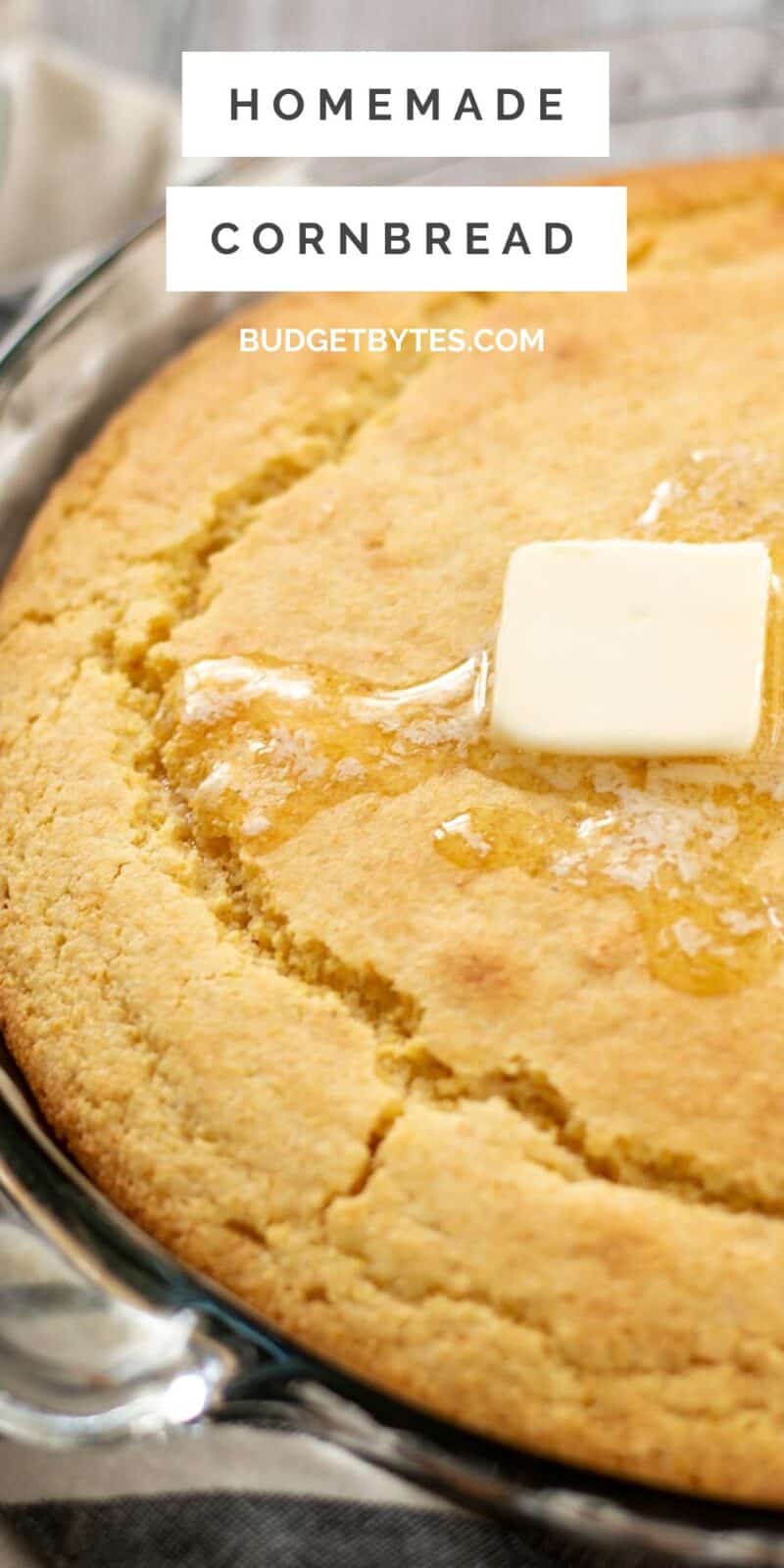 Close up side view of butter melting on baked cornbread.