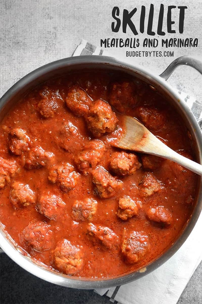 Overhead view of meatballs in sauce in a skillet