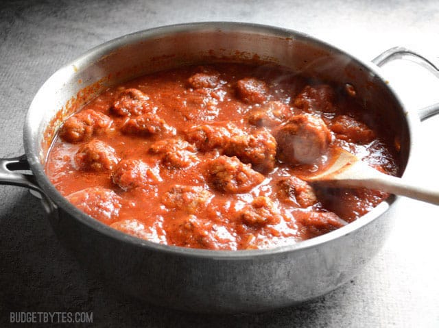 Side view of the meatballs and marinara in a deep skillet