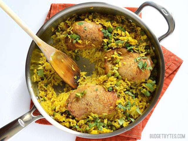 Yellow Rice Chicken Skillet with one portion scooped out