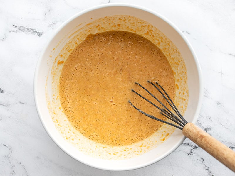 Whisked wet ingredients in a bowl