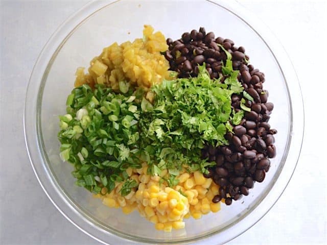 Enchilada Casserole Filling ingredients in a glass bowl