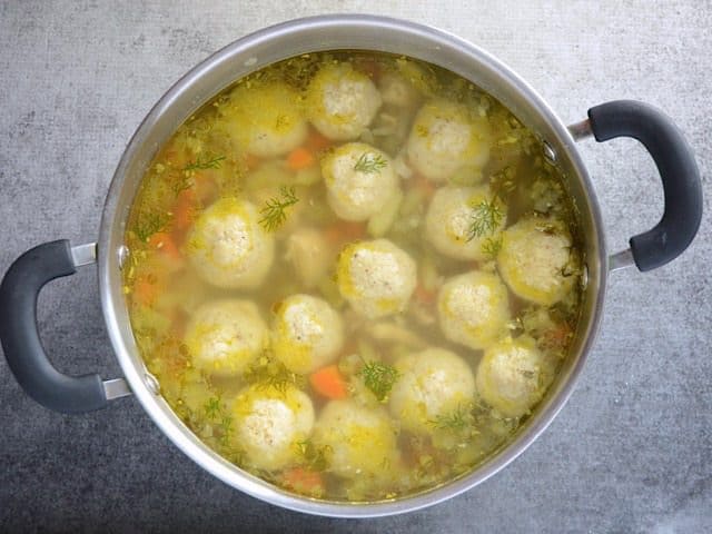Top view of a pot of Finished Matzo Ball Soup