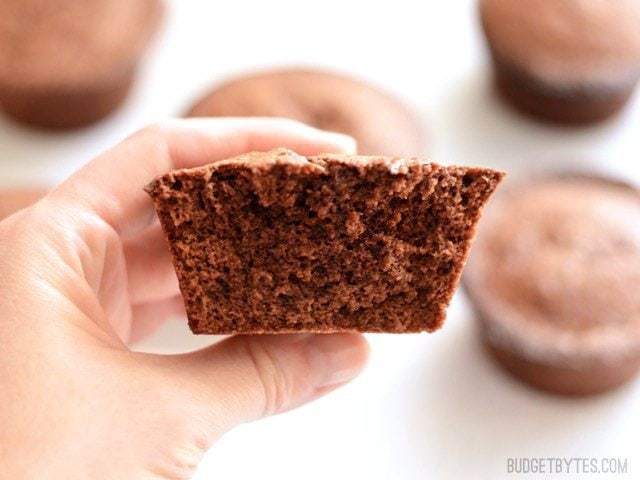 One spicy brownie cut in half, held close to the camera
