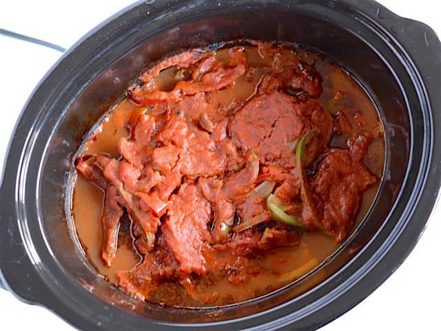 Cooked chicken and peppers in the slow cooker