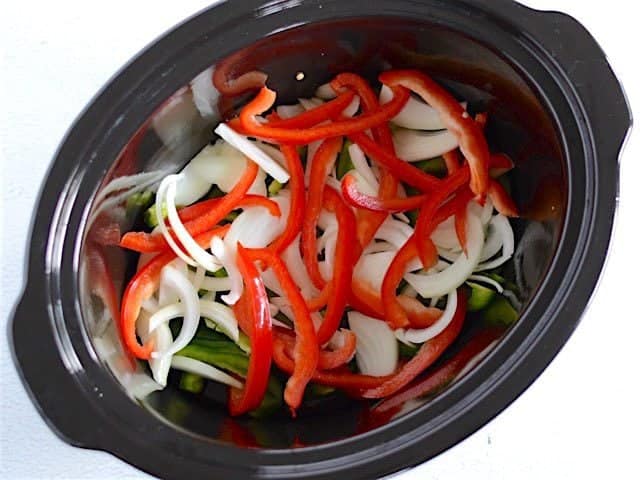 First Layer Peppers and Onions in the slow cooker