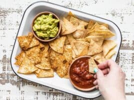 These Homemade Baked Tortilla Chips are fast, easy, super crunchy, a great way to use up leftover tortillas, and a great alternative to store bought chips. Budgetbytes.com