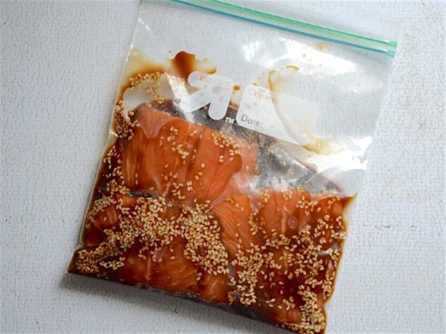 Salmon marinating in a zip top bag