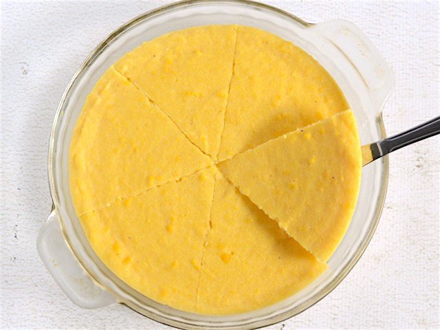 Cooled polenta in the pie plate, sliced into six pieces