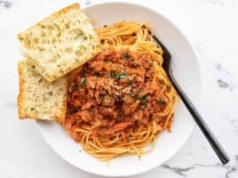 Overhead view of a bowl of spaghetti with hidden vegetable pasta sauce