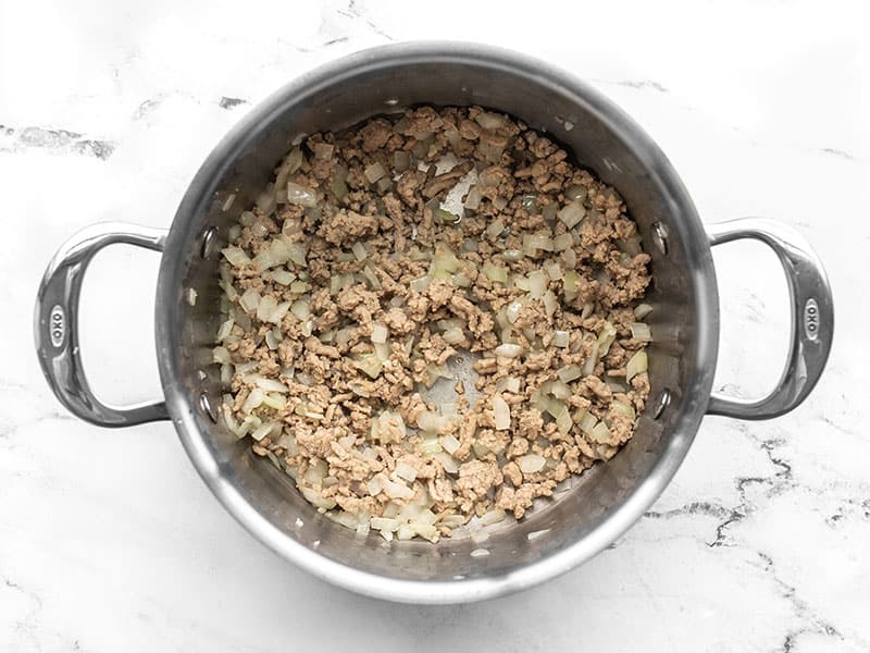 Cooked ground turkey, onion, and garlic in a pot