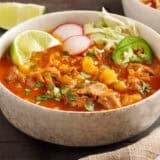 30 minute posole in a bowl topped with garnishes