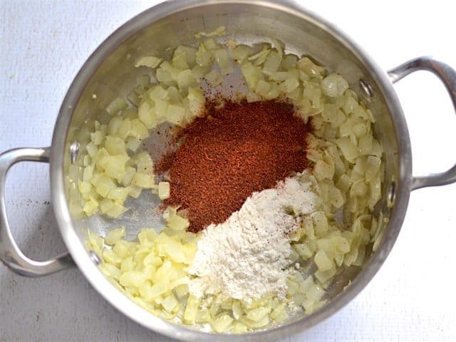 Chili powder and flour added to the pot