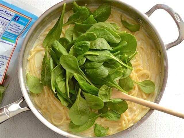 Add Fresh Spinach added to the skillet with pasta