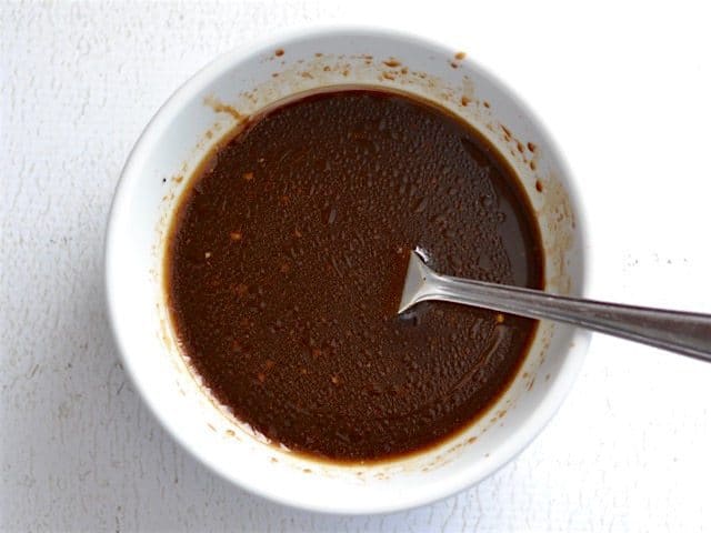 Balsamic Marinade in a small white bowl with a fork