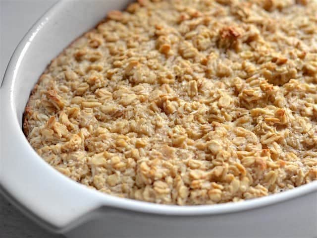 Close up side view of baked oatmeal in the casserole dish