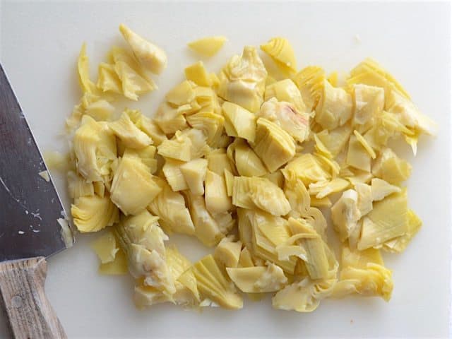 Chopped Artichoke Hearts on the cutting board