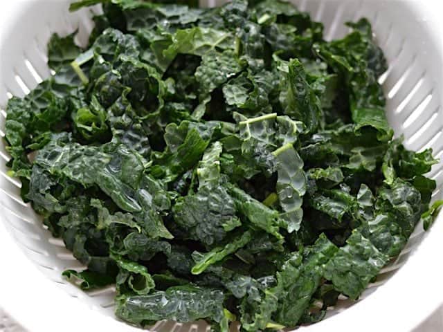 Chopped Lacinato Kale in a colander after being rinsed