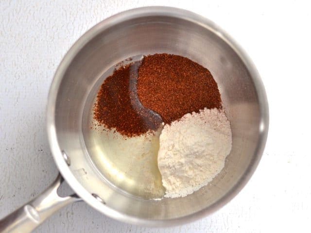 Chili powder, flour, and oil in sauce pot