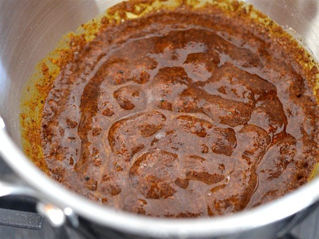 Bubbling enchilada sauce roux in sauce pot, close up