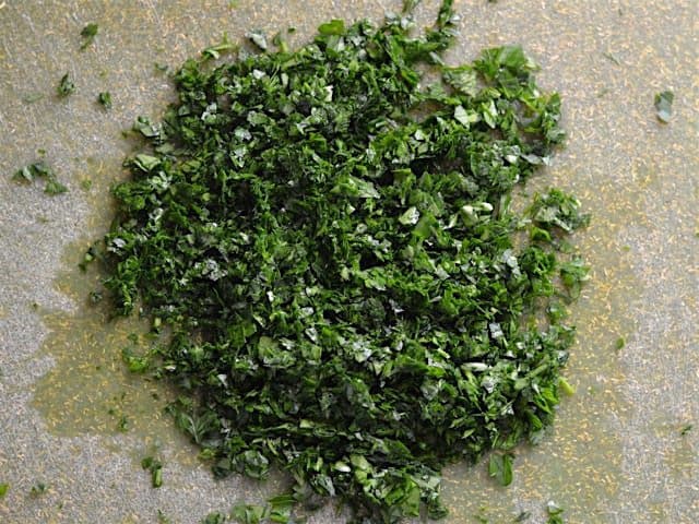 Minced Parsley on a green cutting board