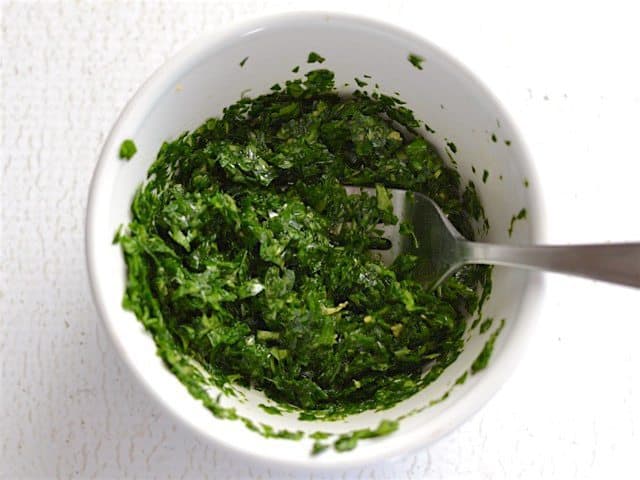 Parsley Lemon Mix in a small white bowl with a fork