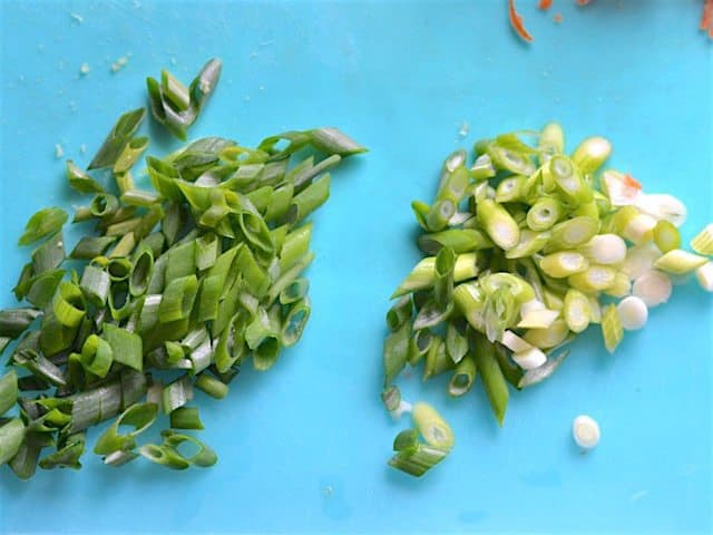 Sliced Green Onion on a blue cutting board