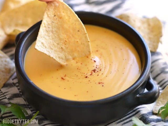Chip mid-dip into 5 Minute Nacho Cheese Sauce