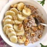 Banana nut breakfast farro served in a bowl with a spoon.