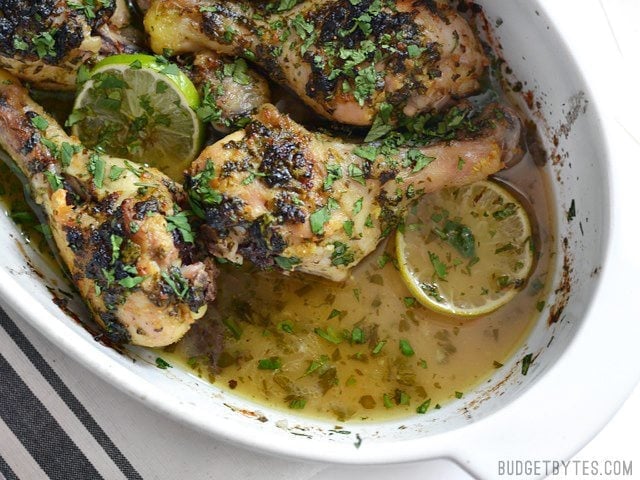 Cilantro Lime Chicken Drumsticks in the baking dish with baking juices