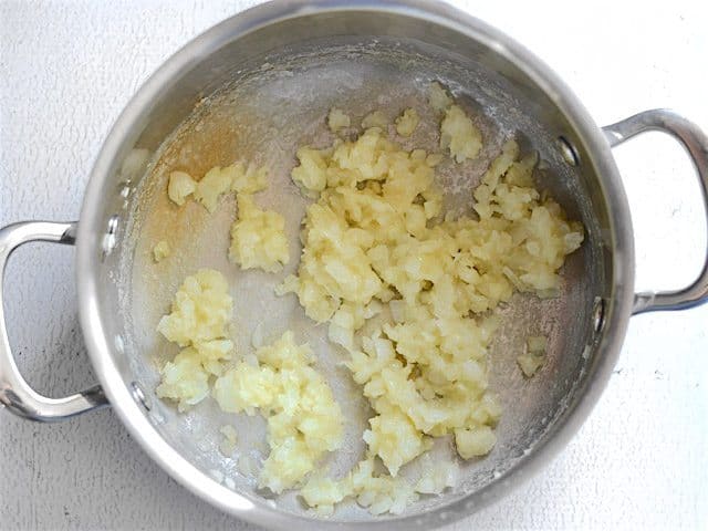 flour added to butter, onions, and garlic in soup pot