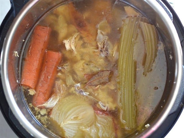 Cooked Chicken Stock in the pot