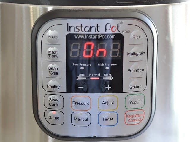 Instant Pot Sauté Mode, front display of Instant Pot reading "on"