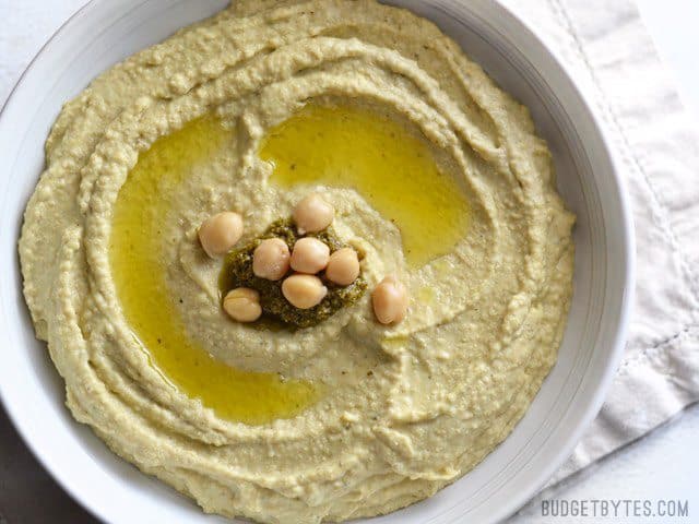 Overhead close up view of a bowl of Pesto Hummus 