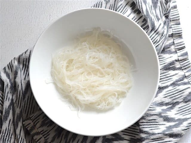 Place Noodles in Bowl for Thai Curry Vegetable Soup