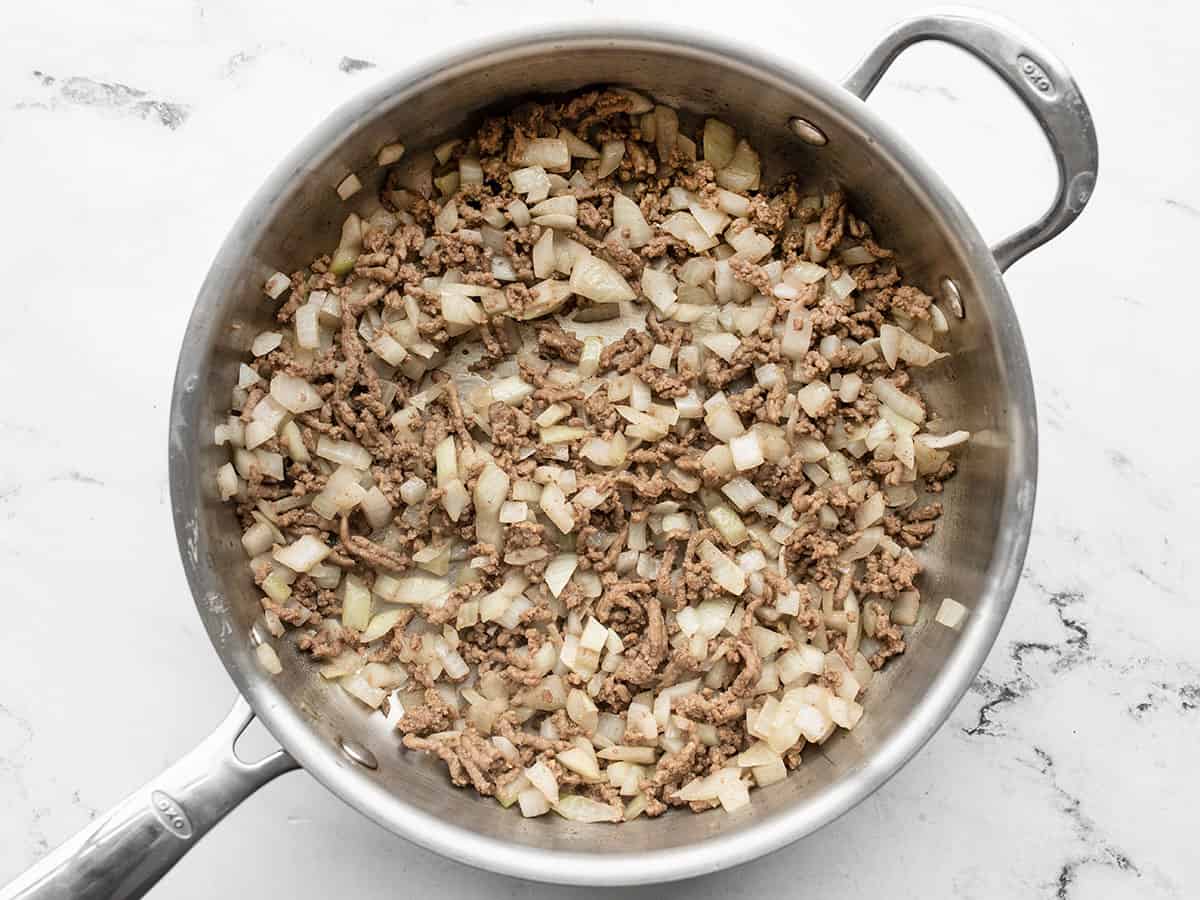 Ground beef and onion cooked in the skillet