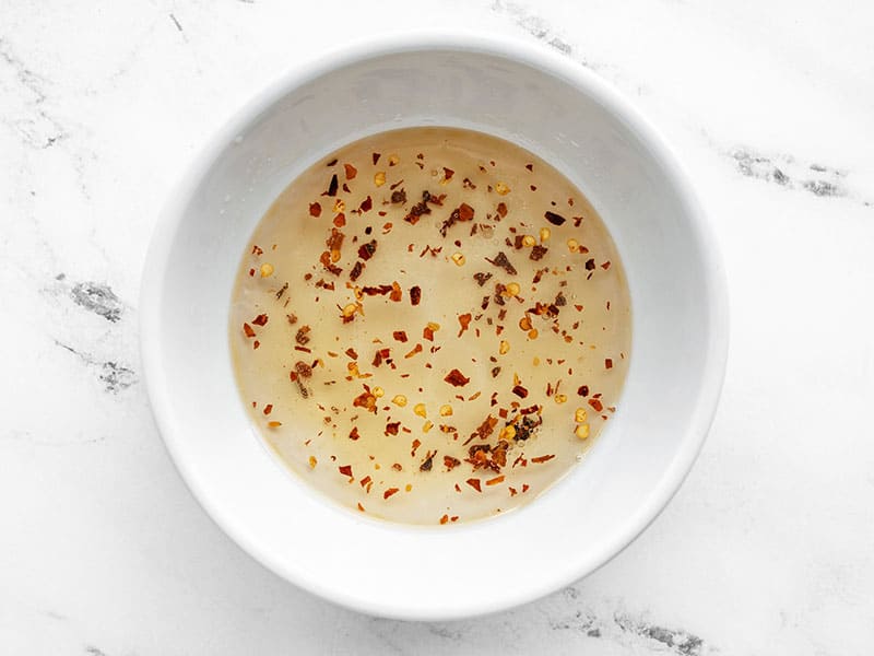 Spicy vinegar dressing in a bowl