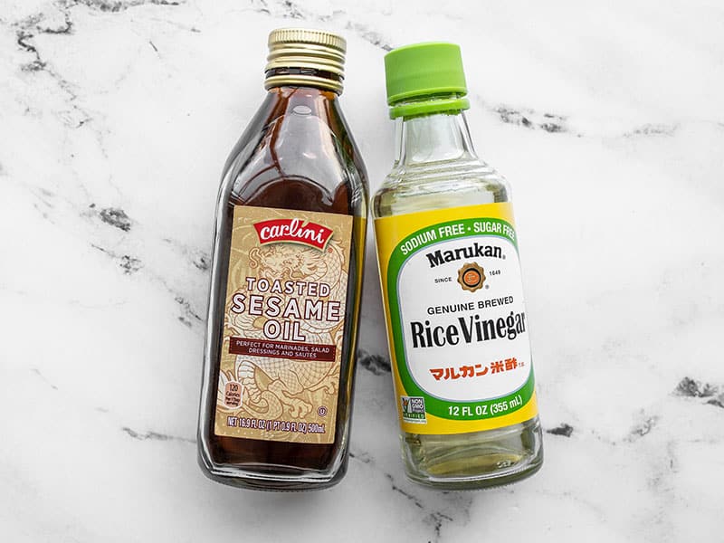 Bottle of toasted sesame oil and a bottle of rice vinegar