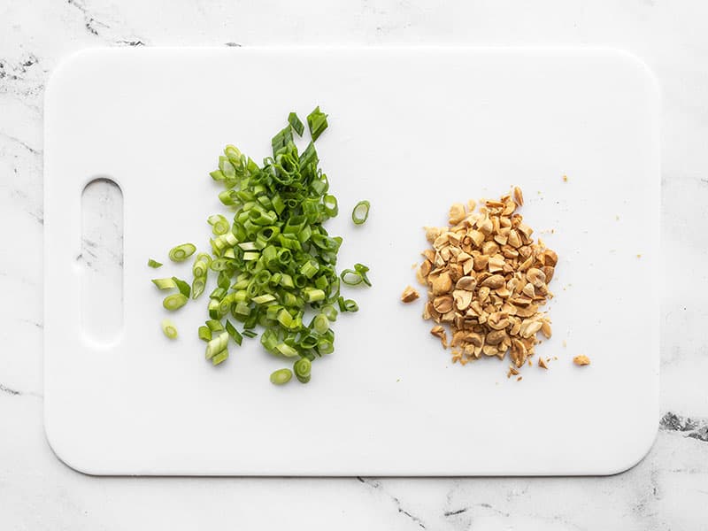 Sliced green onion and chopped peanuts